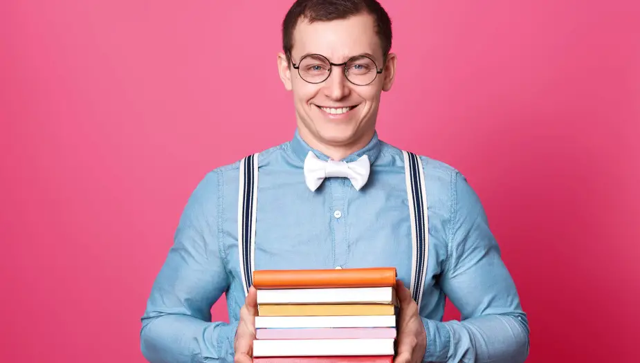 College student holding books about academic strengths examples