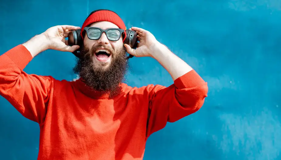 Man excited listening to his INFJ Strengths podcast
