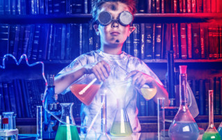 young kid showing off his scientist strengths